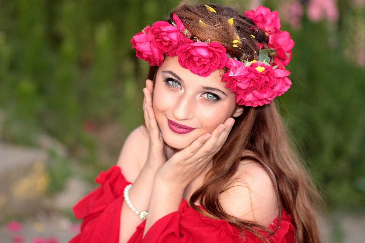 Woman with floral crown and glowing skin, symbolizing natural clean beauty
